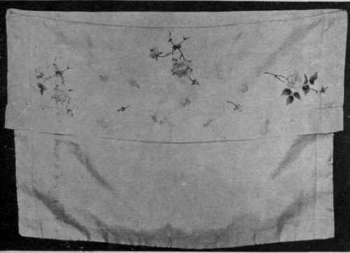 For the nightdress sachet here shown a silk handkerchief is used, simply turned down at one end to form a flap about seven inches deep
