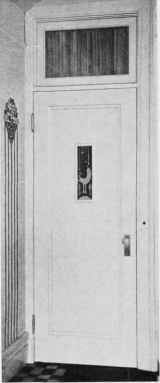 DOOR TREATMENT. Panel of glass with painted design in bright colours.