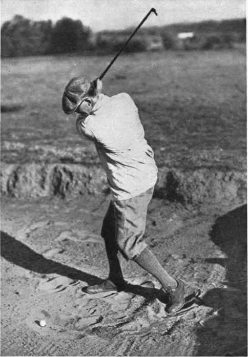 Fig. The back swing for an explosion shot out of a bunker