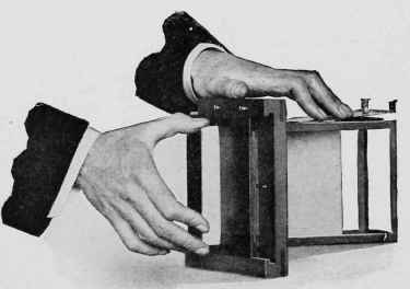Illustration No. 25. Loading Plate Into Rack. See Page 224i.
