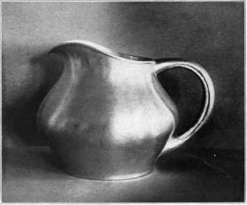 Fig. 105. Solid silver pitcher, one piece hollow handle.