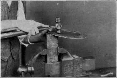 Fig. 63. Beating up the round plate.