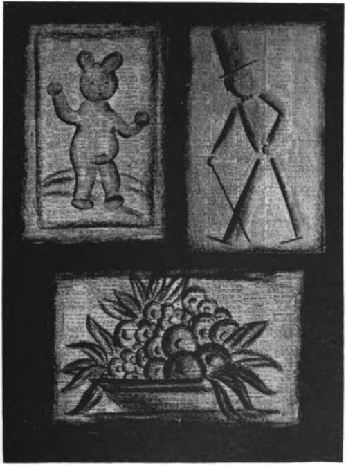 short piece of crayon on newspaper