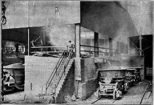 Fig. 17.   Ladles Receiving Molten Pig Iron from Blast Furnace Troughs.
