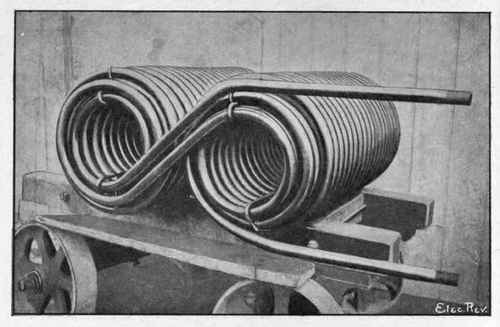 Fig. 54.   Pipe Coil for Refrigerating Machine, Electrically Welded by Thomson Process. Pipes Welded end to end by moving Welding Machine during Operation of Coiling.