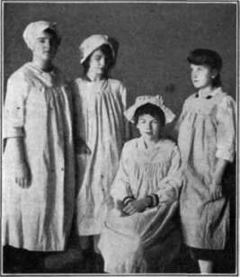 Fig. 24.   Four of the Pleasant Valley girls wearing their finished aprons.