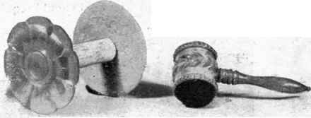 A Fancy Holder for a reel of cotton. The top is mother of pearl. The Ivory Mallet is a pin cushion.