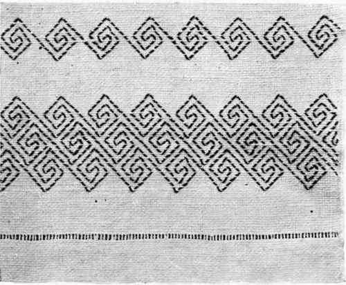 A TOWEL IN GREEK FEET DESIGN.