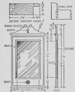 A mirror of rare charm with inlaid lines, decorative inserts, and rosettes.