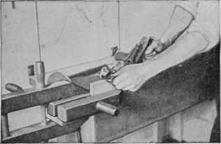 How the hand screws are placed on the kitchen table bench for planing wide boards.