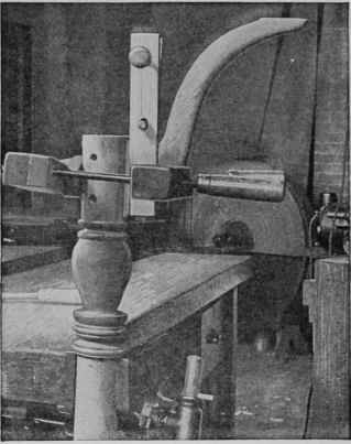 One leg at a time is glued to the column and held firmly with three hand screws.
