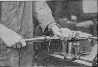 Start the cut near the dead center and move the tool toward it. Hold the tool as illustrated and stand in the position shown.