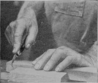 The shoulder of a tenon can be cut more easily if a notch is first made for starting the saw.