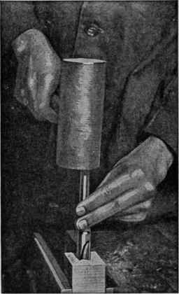 Use a wooden mallet to drive the live center into the wood. This is particularly important when the stock is hard wood.