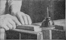 When honing a knife, take long strokes back and forth on the oilstone, turning the blade at each stroke and sharpening against the edge. In other words, the cutting edge is pushed forward.