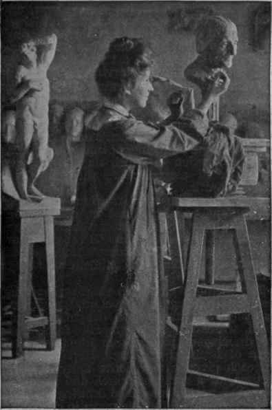 A girl sculptor at work on a bust