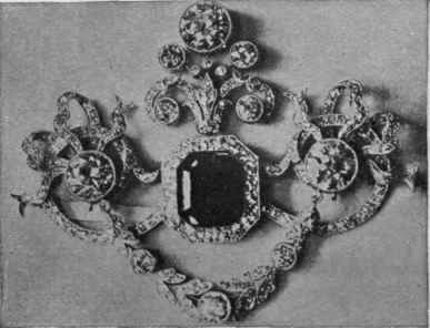 A magnificent emerald and diamond ornament 