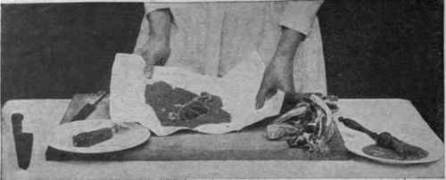 Fig. 3. Lay the cutlet on the crumbs in a piece of white paper, to avoid touching it wit