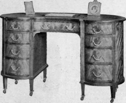  Kidney shaped pedestal table of inlaid mahogany