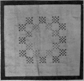 Pattern on plain linen in cross stitch, which was embroidered over canvas, now removed