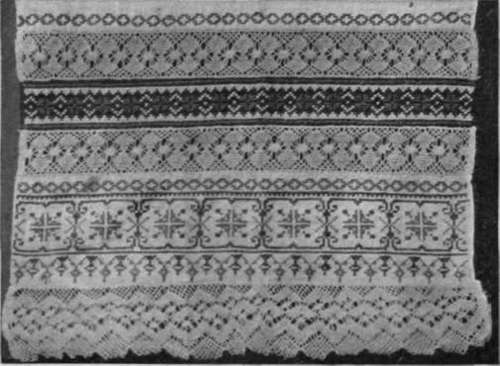 This embroidered cloth may be used for a splasher