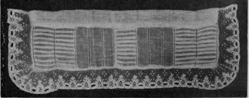 A collar of tucked muslin trimmed with Buckinghamshire lace. Worn over black satin, such a collar is seen to good effect
