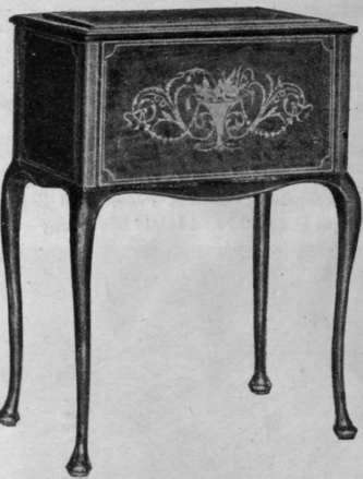 A jardiniere of inlaid marquetene, which, when filled with conservatory plants, has a charming effect in a drawing room