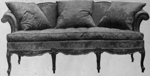 A modern copy of a very beautiful settee of the 18th century, made comfortable by the addition of a down mattress and cushions