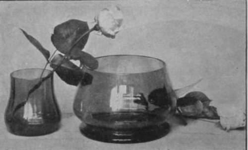 A plain glass bowl of this shape is useful for roses. The smaller vase is intended to be filled and placed inside the bowl and thus support the roses in the centre