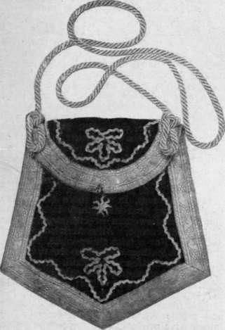A satchel bag of black velvet, trimmed with platinum braid