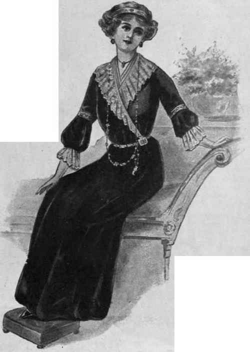 A velvet frock with a frill of old lace at the neck and ruffles to the sleeves. Fastened with a single hook and eye at one side of the waist, it is quickly donned. Barbaric jewellery may be worn with a gown of this description