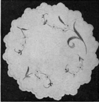 A white velvet d'oyley, with a design of natural flowers in French painting