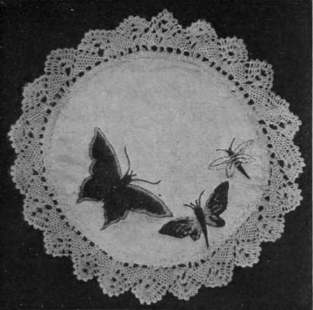 Fig. 3. The tortoiseshell butterfly is worked in satin stitch in blue, yellow, black, red, brown, and flame colour. The smaller butterfly is worked in yellow, chocolate, and green, the smallest in blue