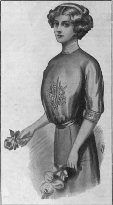 Mercerised muslin blouse, painted with a floral design in pale blue and soft green leaves. The design is then outlined in stem stitch with an embroidery silk