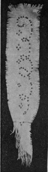 Sketch out the design on the suede and sew the chenille, previously threaded with the beads, on to it with fine silk. Snip the edges of the suede to form a fringe