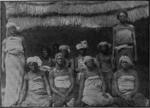 Some of the many wives of the eldest son of the King of Ogo, who receive instruction each week from