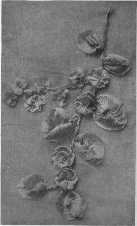 A floral spray in  hoarfrost  embroidery. Dainty and light, such a spray can be worn in the hair or as a corsage ornament