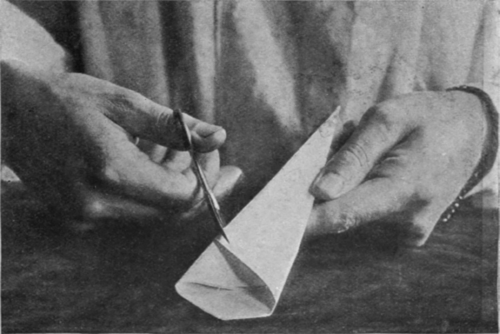 Cutting the folded paper before punching