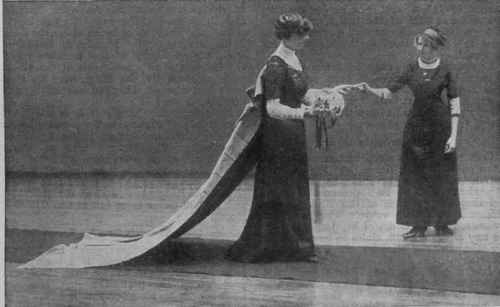 Fig. 1 How the debutante should enter the Throne Room and present her card to the Lord Chamberlain, represented at the rehearsal by the figure on the right. Her train is shown as it would appear after being spread at the entrance by the pages
