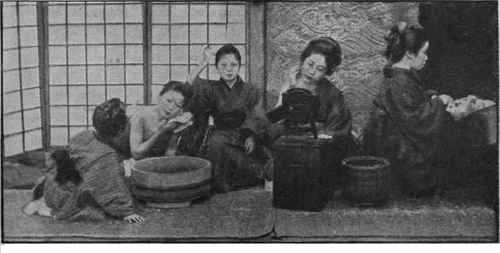 Little Japanese girls at their toilette. In every rank of life, both children and adults attach the greatest importance to personal cleanliness and neatness. Girls and boys are trained from infancy to be punctilious in this matter