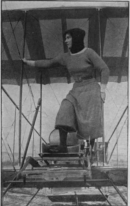 Mrs. Maurice Hewlett in an aeroplane at the Brcoklands School of Aviation, over which she Photo, and Mons. Blondeau preside Press Picture Agency