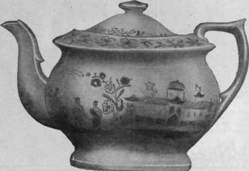 The teapot of the service, showing in detail the beautiful ornamentation employed