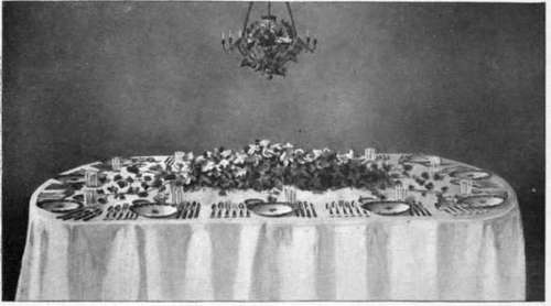 An Autumn Dinner Table Decorated With Vines