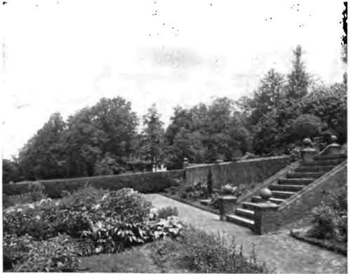 Stately steps descend into the formal garden.