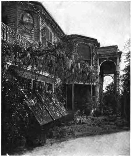 Vines overrun it on all sides, and convert its spacious verandas into avenues of shade.