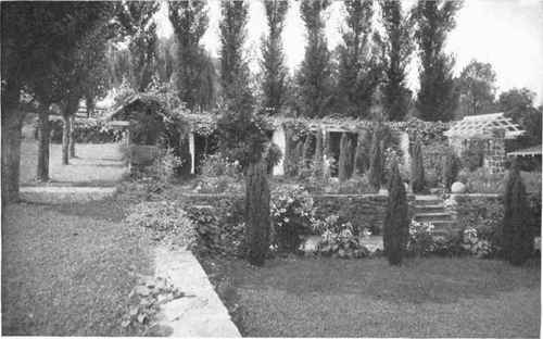Fig. 121.   Retaining walls in the garden. How much more effective is this treatment than the slope generally adopted when the garden is on more than one level.   See pages 144, 146.