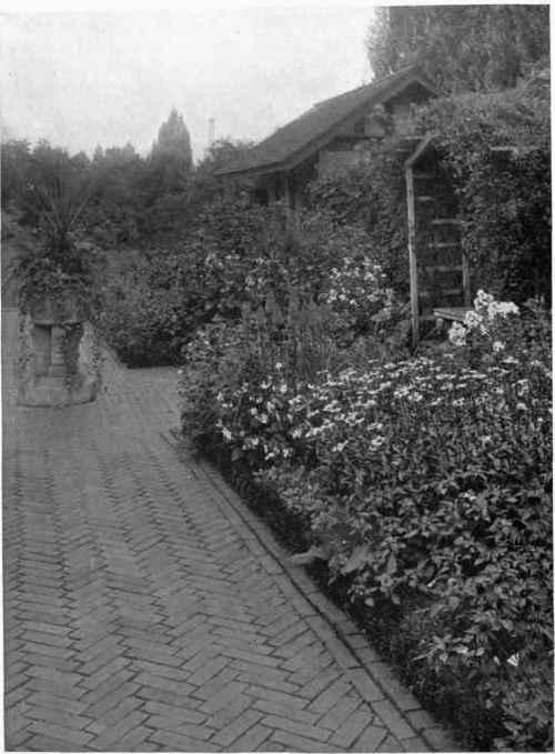 Fig. 144. WELL PLACED GARDEN SEAT WITH COVERING