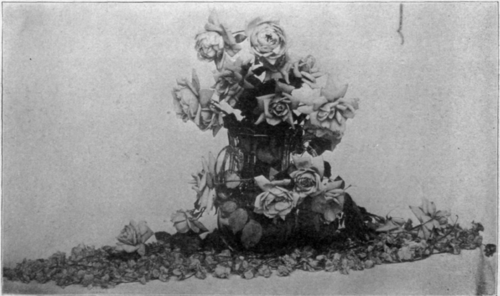 Table Center piece of Violets and Roses.