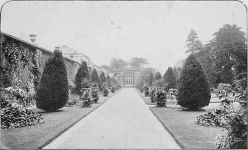 The Conservatory Walk At Tatton Park, A Formal Straight Walk With Conifers And Vases.