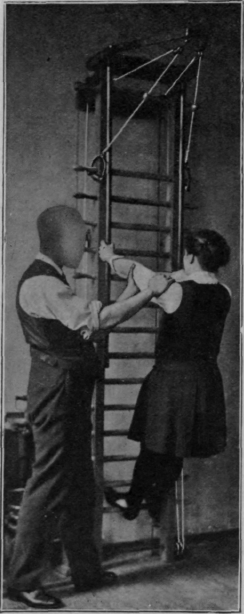 Fig. 92.   To show one method of assisting movement while the patient is exercising on the ladder. The masseur is assisting extension of the elbow